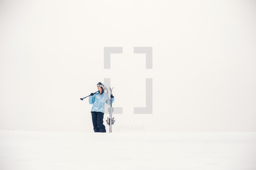 woman skiing in winter snow 