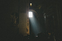 light shining through a window into a Cathedral in Rome