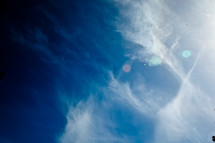 wispy clouds in a cobalt blue sky