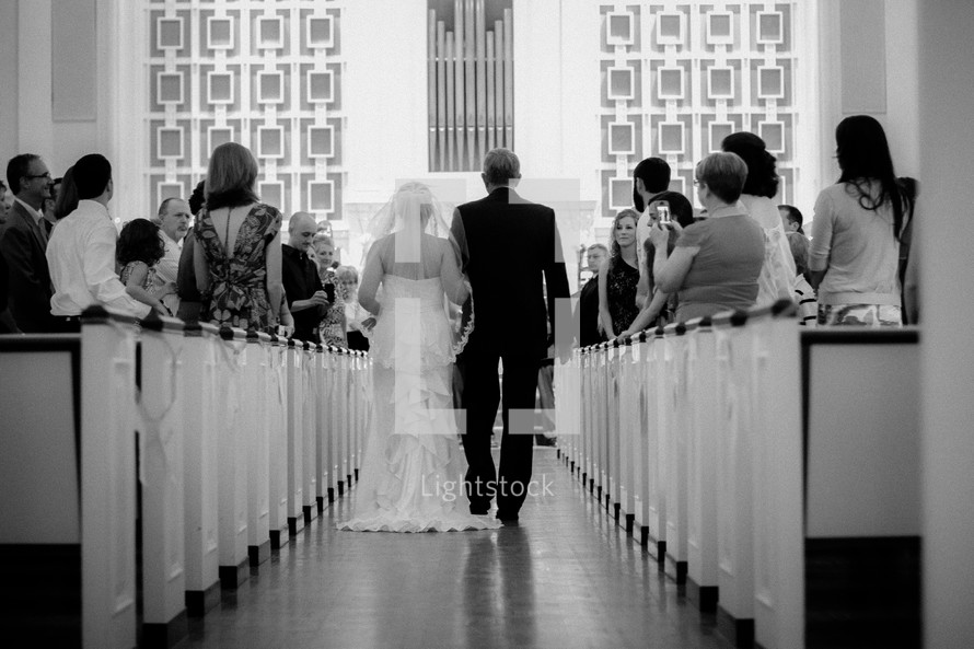 father walking his bride daughter down the aisle