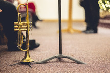 Trumpet on a floor stand with blurry background