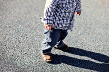 Boy standing on concrete