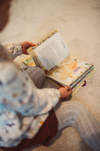 child reading a children's Bible 
