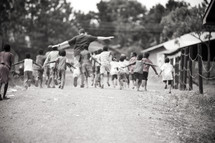 man leading a group of children
