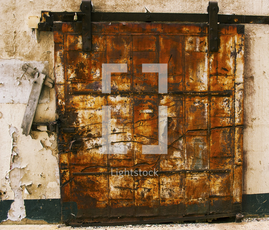 rusted and locked cover over a window