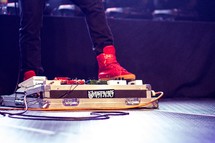 feet on guitar pedals