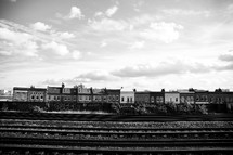 Row houses by train tracks