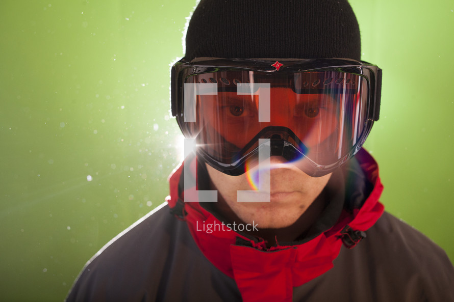 man standing in ski goggles