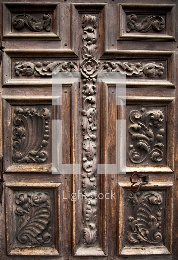 ornate wood door to the sanctuary of one of the San Antonio missions