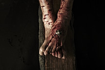 The feet of Jesus nailed to the cross
