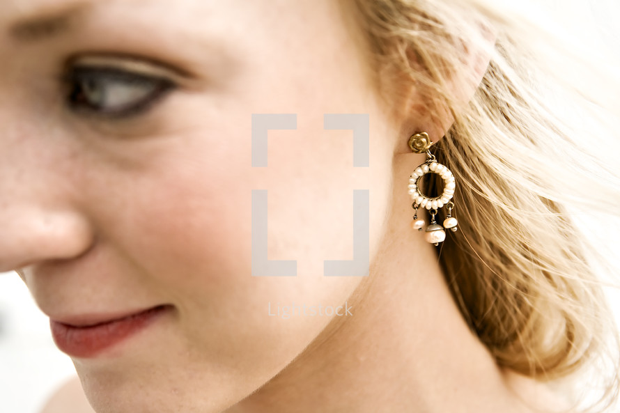 profile of a woman wearing earrings