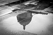 reflection of a dome in a puddle