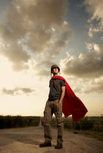 Man wearing a red cape and helmet