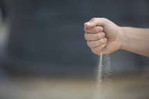 Hand sifting sand
