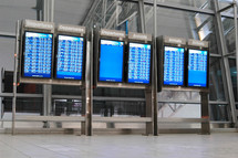departures and arrivals board at an airport 