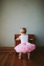 toddler girl and a piano 