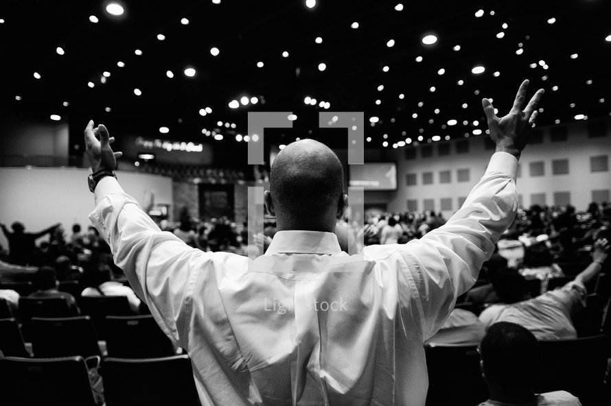Outstretched hands during a worship service.