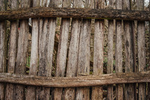 Outdated wooden fence in old village, wood planks, texture. High quality photo