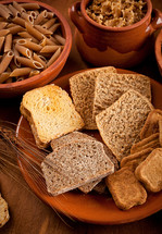 Whole grain carbohydrates on wooden table