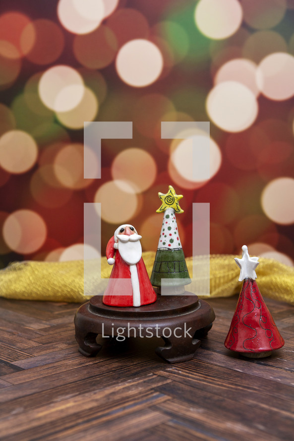 Small clay Christmas decorations with bokeh background