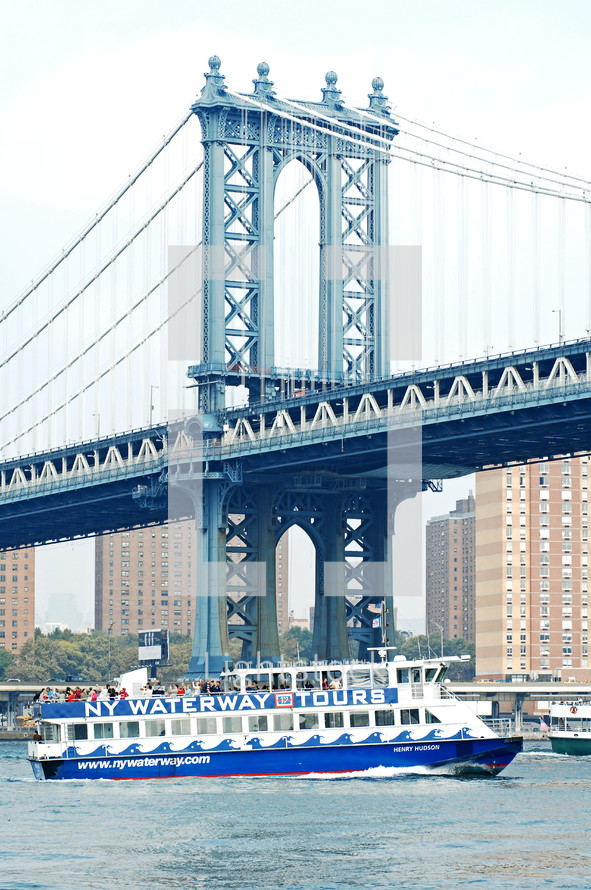 ferry boat under a bridge in NYC 