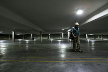 Man in empty parking garage