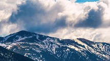Dramatic stormy clouds in spring alps mountains Time lapse Nature
