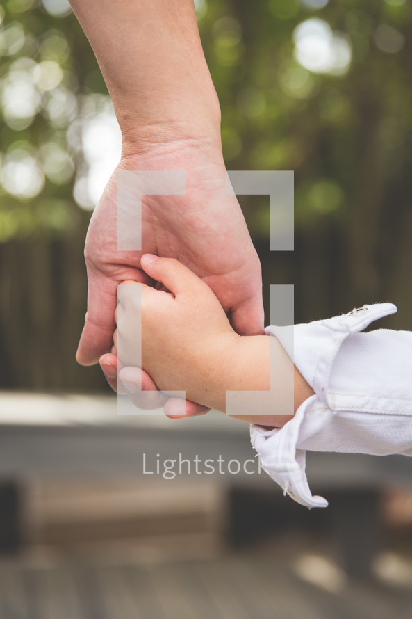 mother and daughter holding hands 
