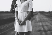 couple standing on a rural road 