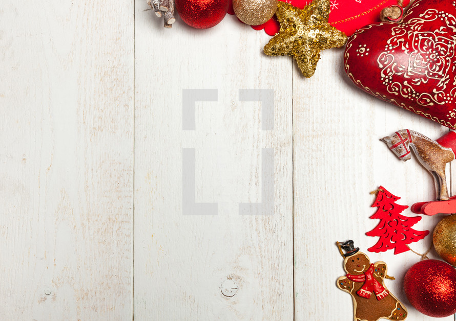 Christmas frame on rustic white wood background and decorative objects.