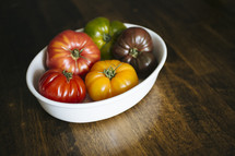 a variety of tomatoes in a bowl 