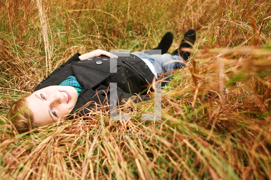 Woman lying in field