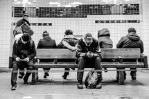 people waiting in a subway station 
