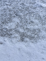 Snowflake pattern on frozen lake