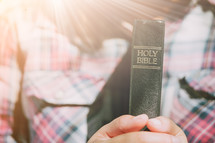 holding a Bible close to your heart 