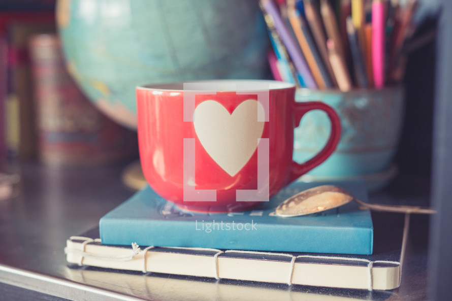 Valentine's coffee mug on a desk 