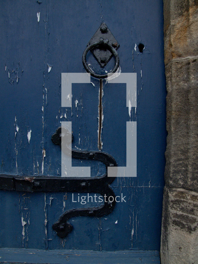 door pull and henge on a blue door