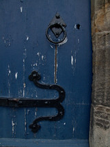 door pull and henge on a blue door