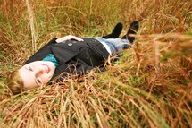 Woman lying in field