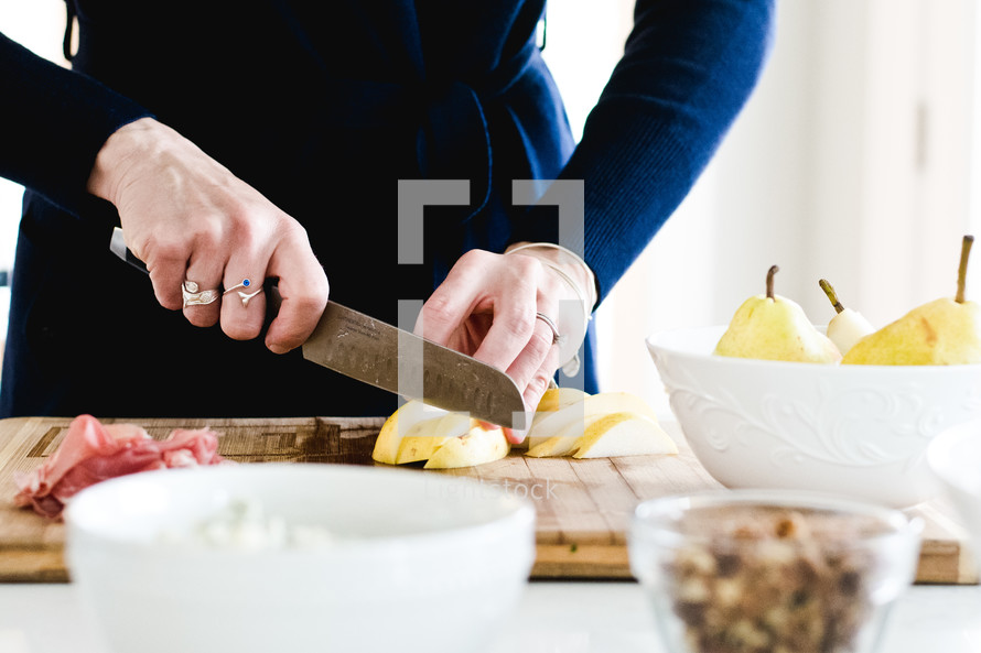 a woman chopping pears 