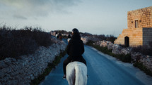 horseback riding on a trail 