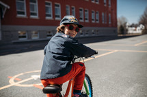 child riding a bike to school 