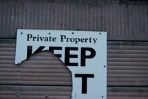 torn private property keep out sign
