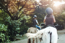 children riding horses 