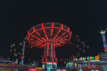 rides at a fair at night 