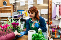 Florist with professional clothing in a plant nursery. 