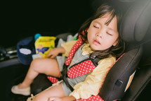 sleeping child in a carseat 