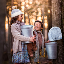 children collecting maple syrup 