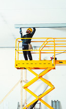 Worker at work in the construction of a plasterboard wall