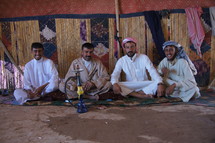 Nomadic tribesmen in desert tent
